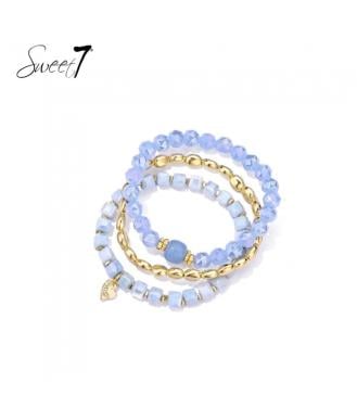 Armband set met lichtblauwe facet kralen en goudkleurige accenten
