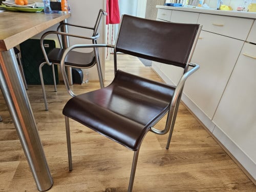 4 RVS en lederen eetkamerstoelen