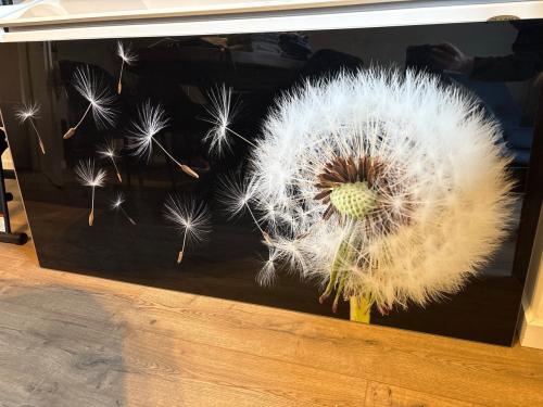 Schilderij van glas paardenbloem