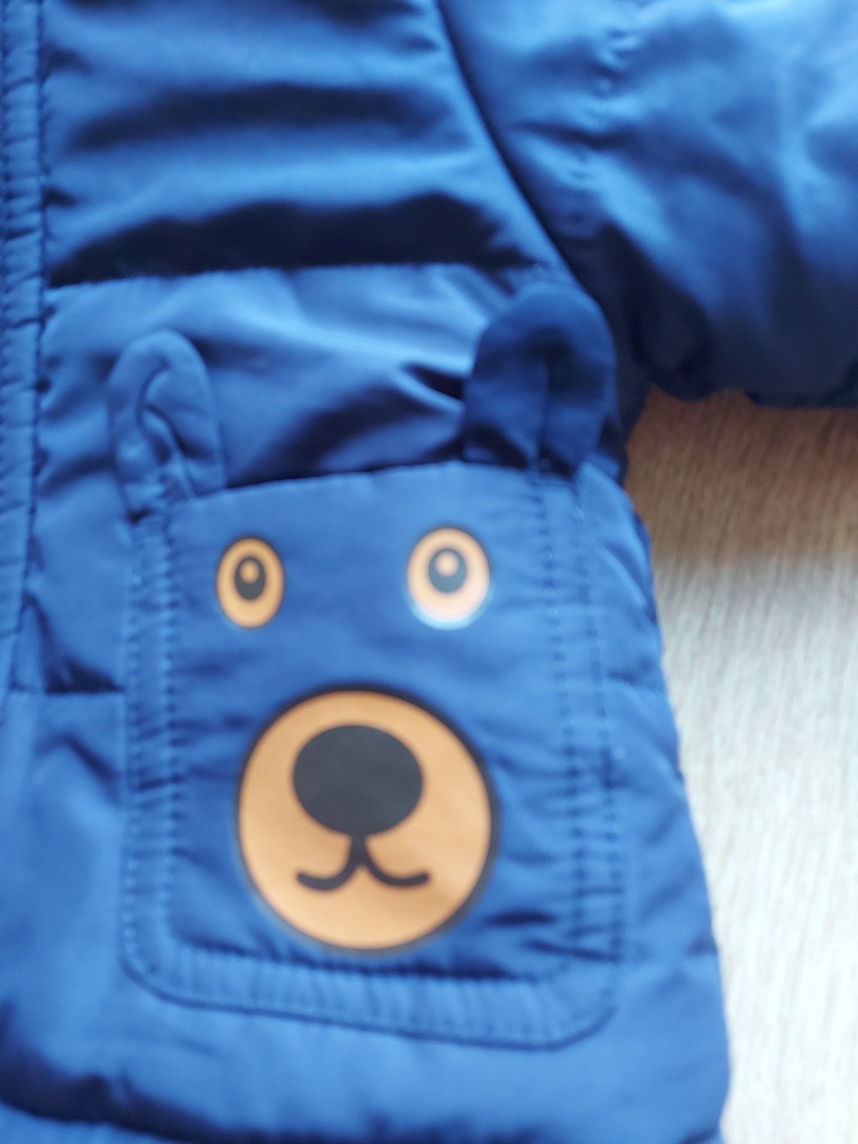 Leuke donkerblauwe jongens winterjas (maat 74 / 80)