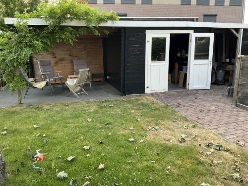 Overkapping en tuinhuisje / schuurtje
