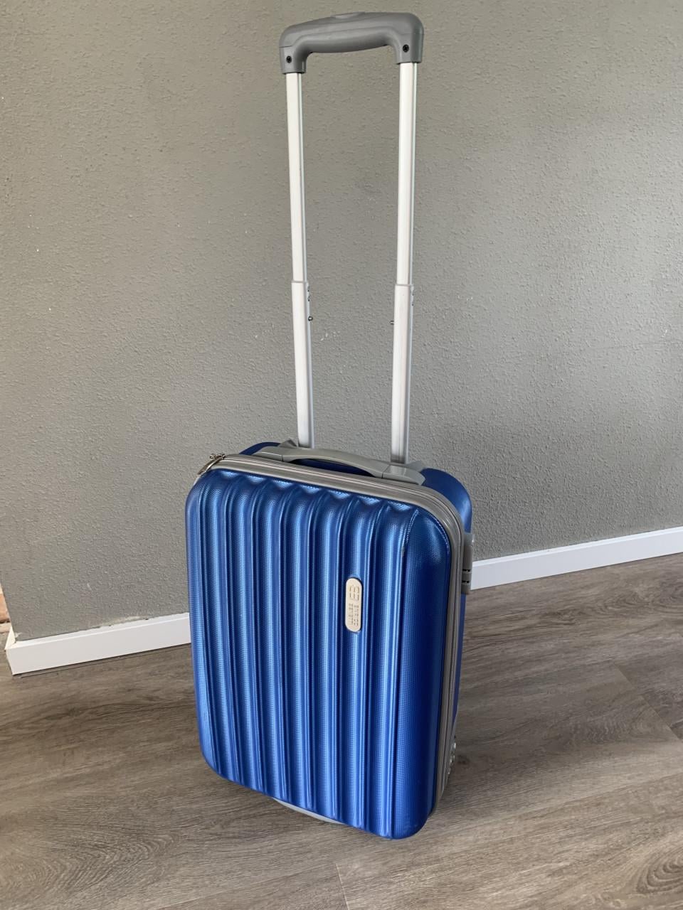 Compacte blauwe handbagage koffer