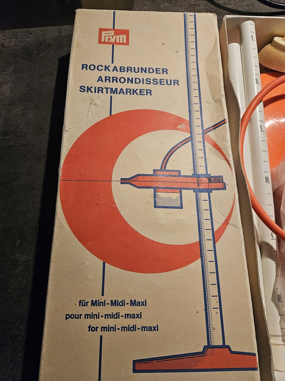 Mooie vintage prym rokzoommeter/rokspuit oranje, in originele doos