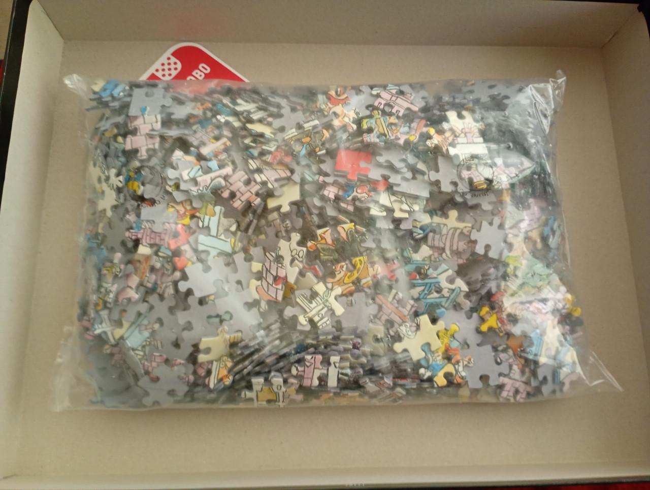 Legpuzzel wasgij. Puzzelstukjes nog in seal