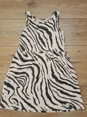 Ecru, beige met zwarte dierenprint jurkje van H&M  Maat 122-128