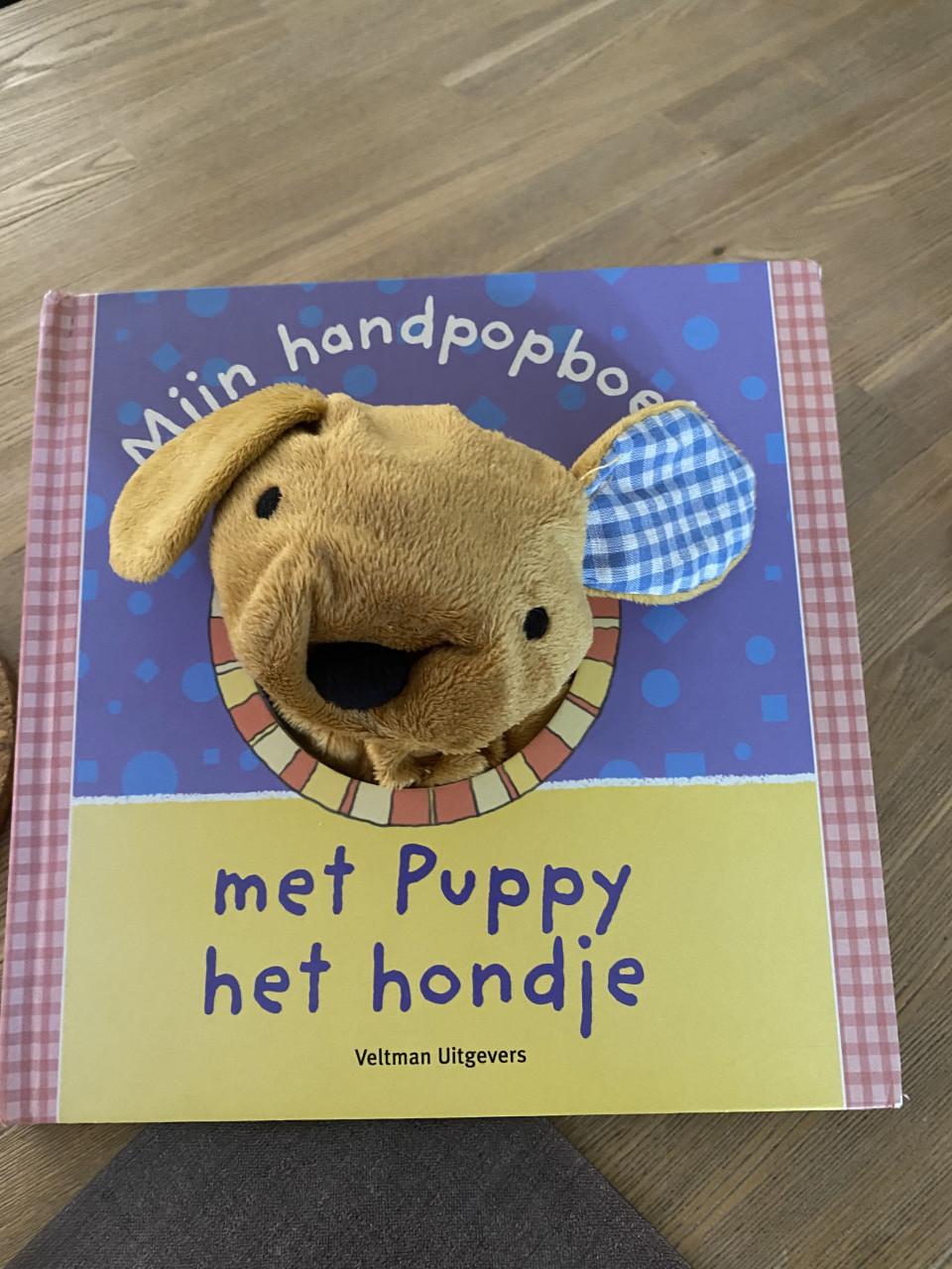 Zo goed als nieuw Handpopboek Puppy het hondje