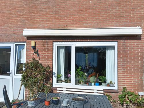 Zonwering knikarmscherm