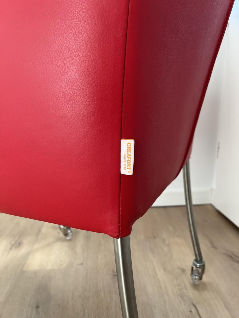 Twee Creafort fauteuils rood leder