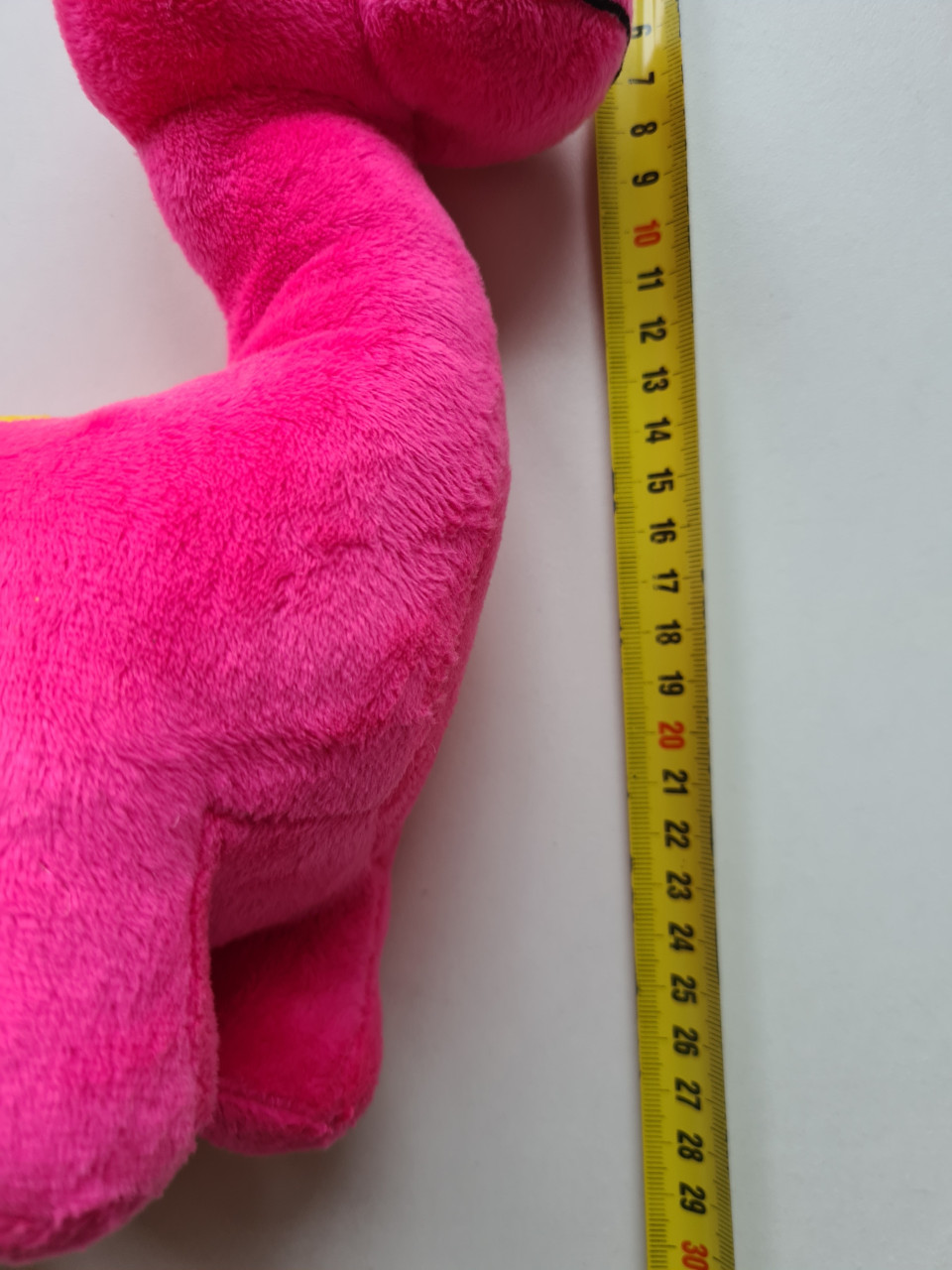 Schattige roze dinosaurus knuffel