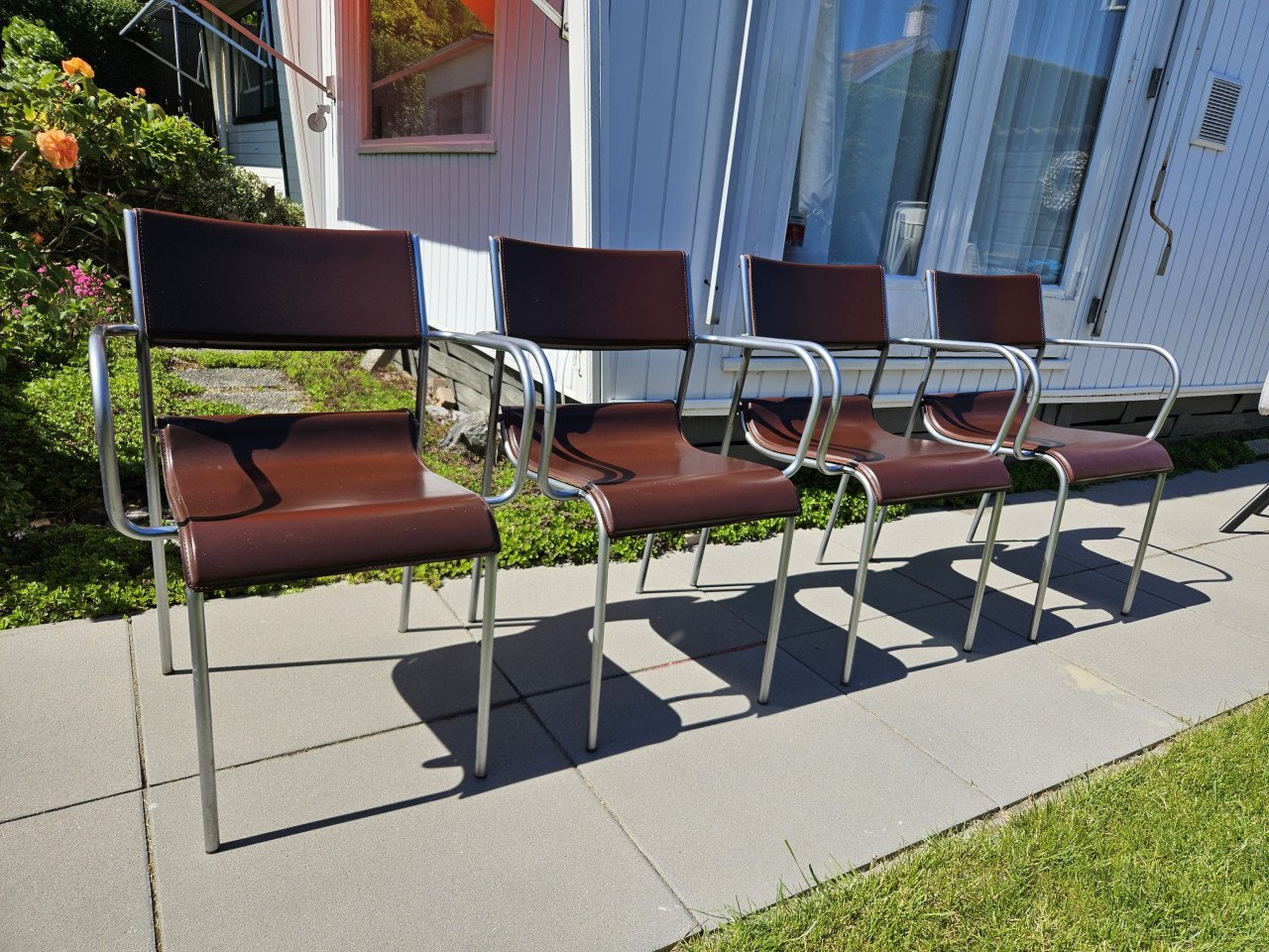 4 RVS en lederen eetkamerstoelen