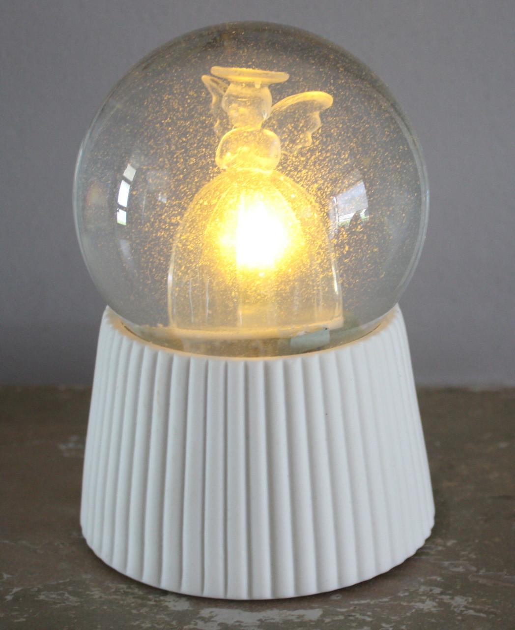 Sneeuwbol met lichtgevende engel