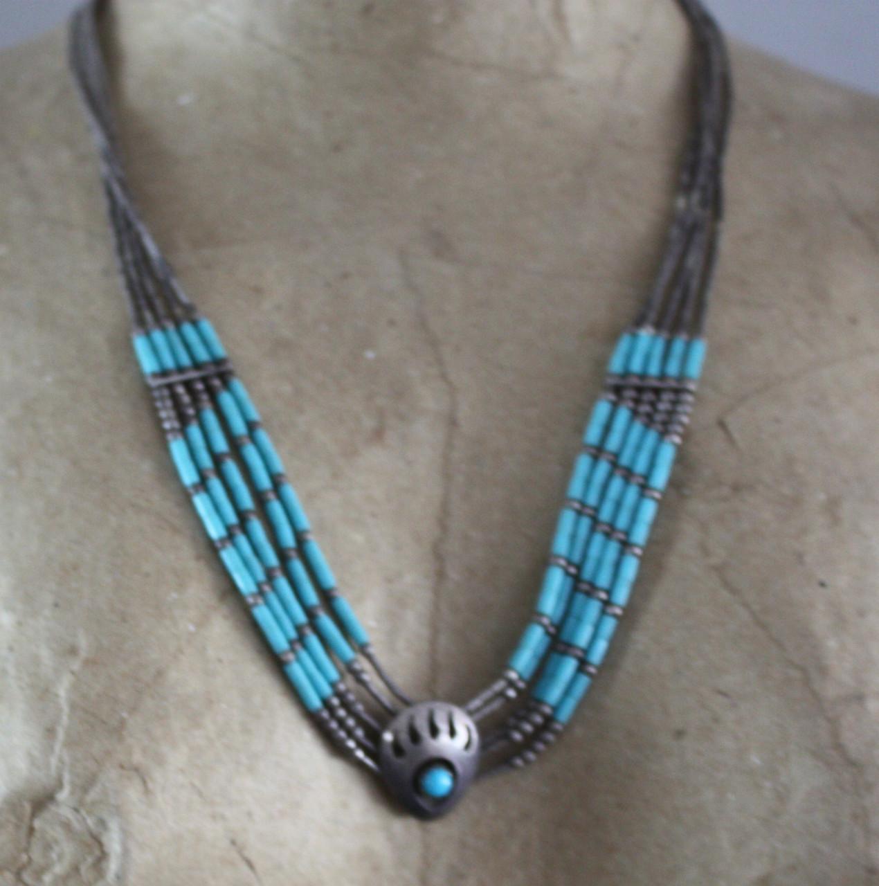 Zilverkleurige kettig met turqois kralen