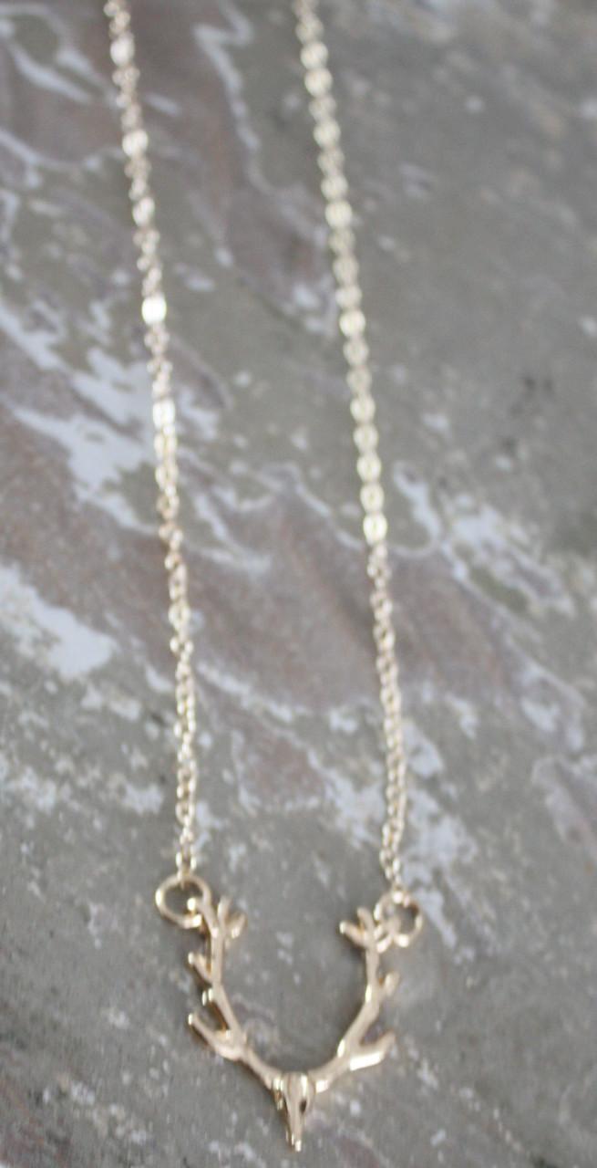 Goudkleurige ketting met herten kop