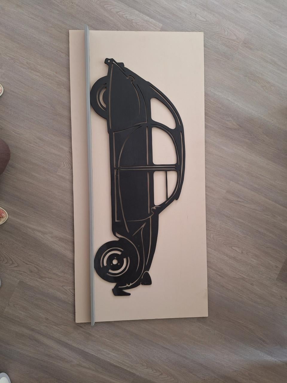 Citroën 2CV aan de wand