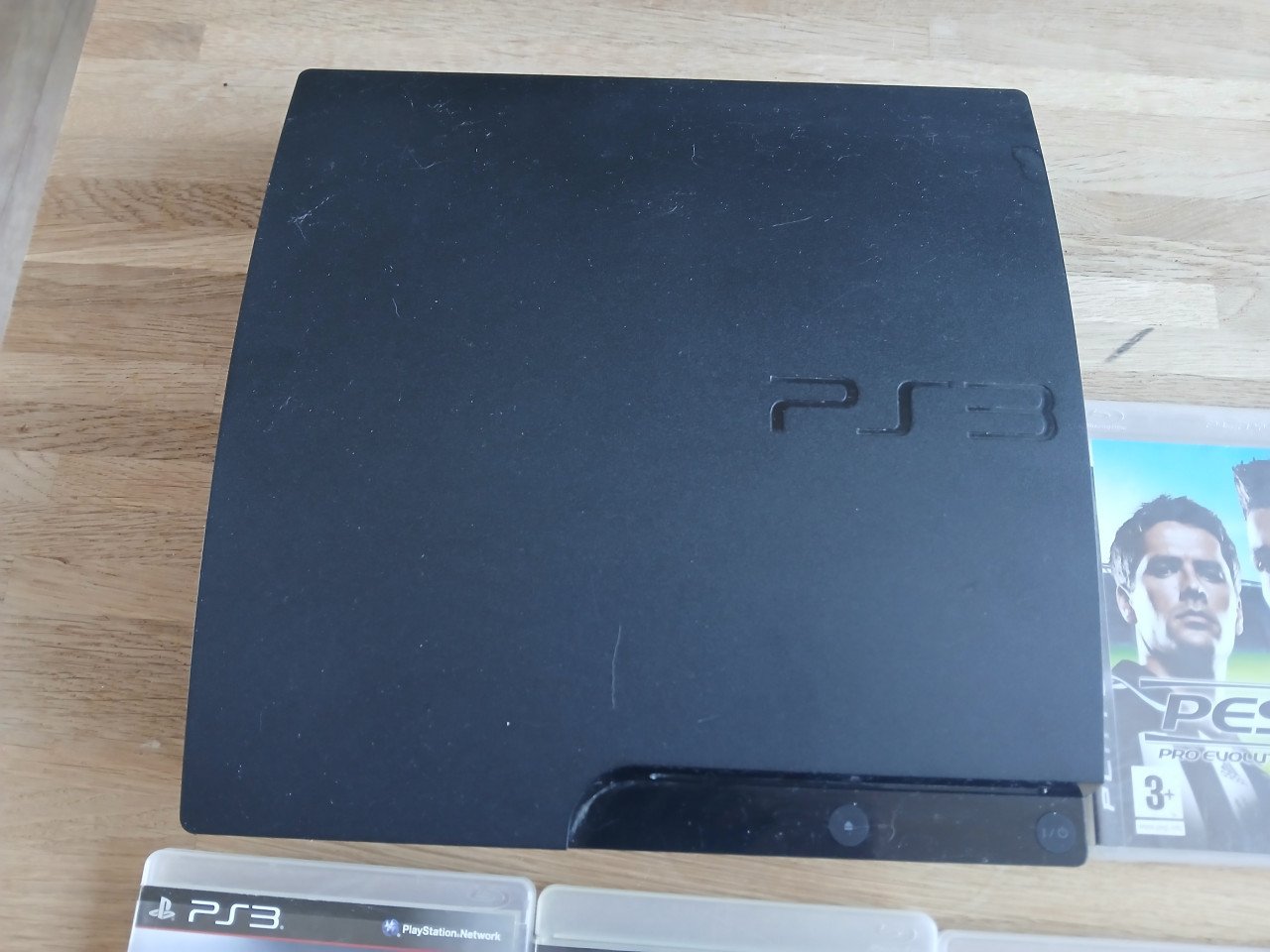 Playstation 3 met 2 controllers en 8 games
