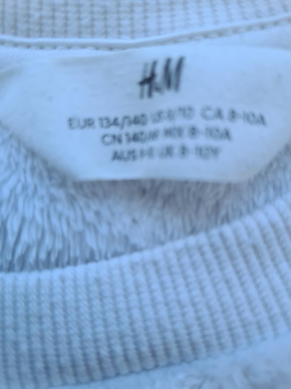 Ecru zachte sweater met pailletten unicorn van H&M  Maat 134-140