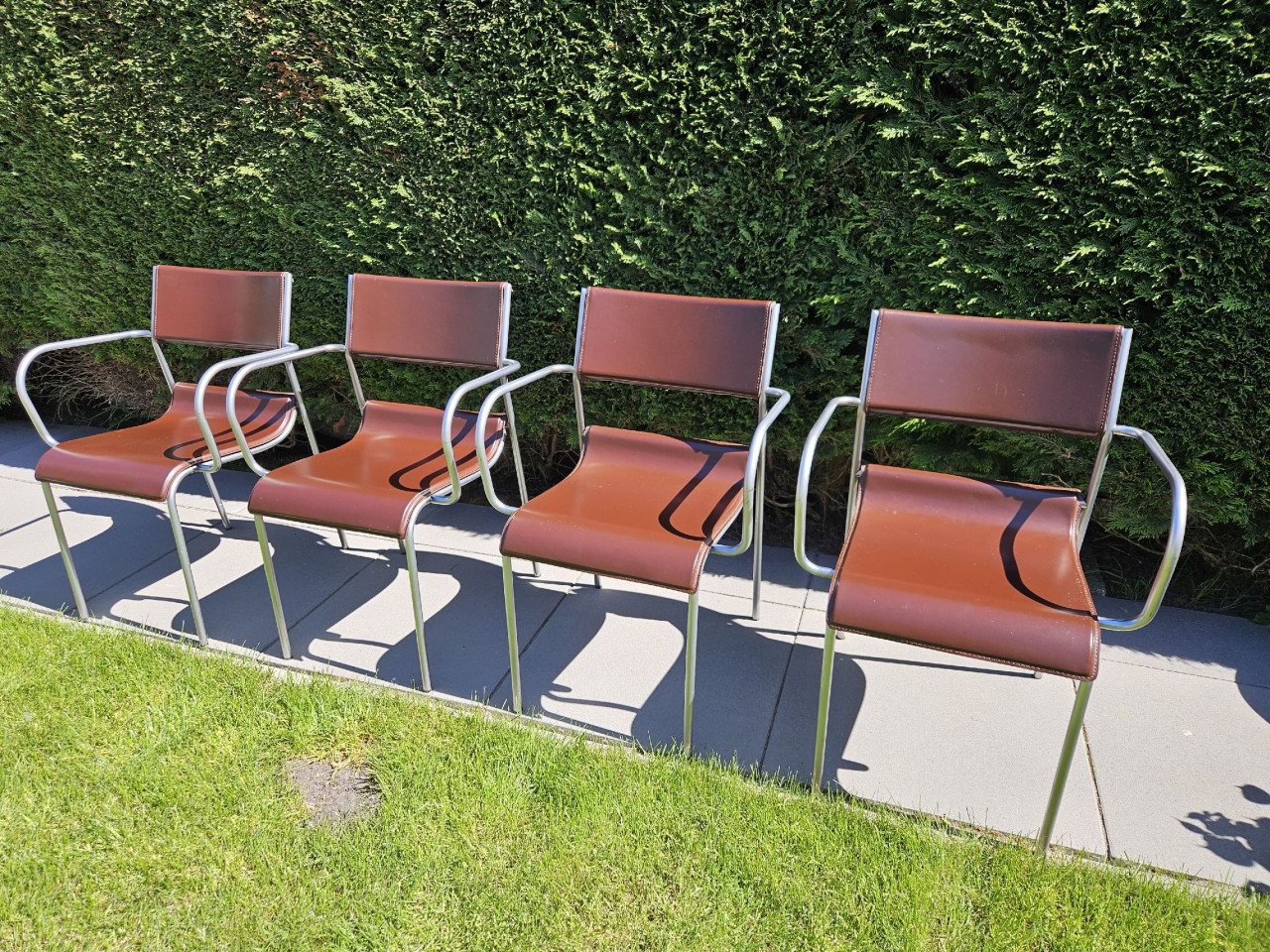 4 RVS en lederen eetkamerstoelen