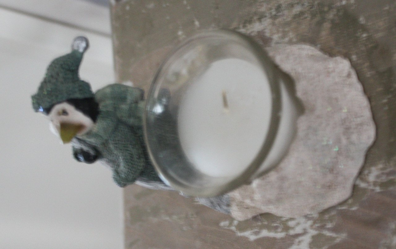 Stenen theelicht met pinguin