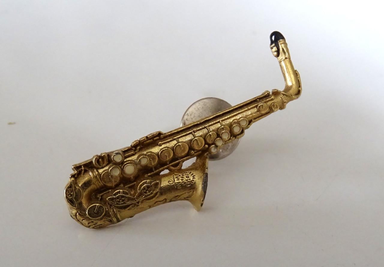 Saxofoon speldjes en manchetknoop