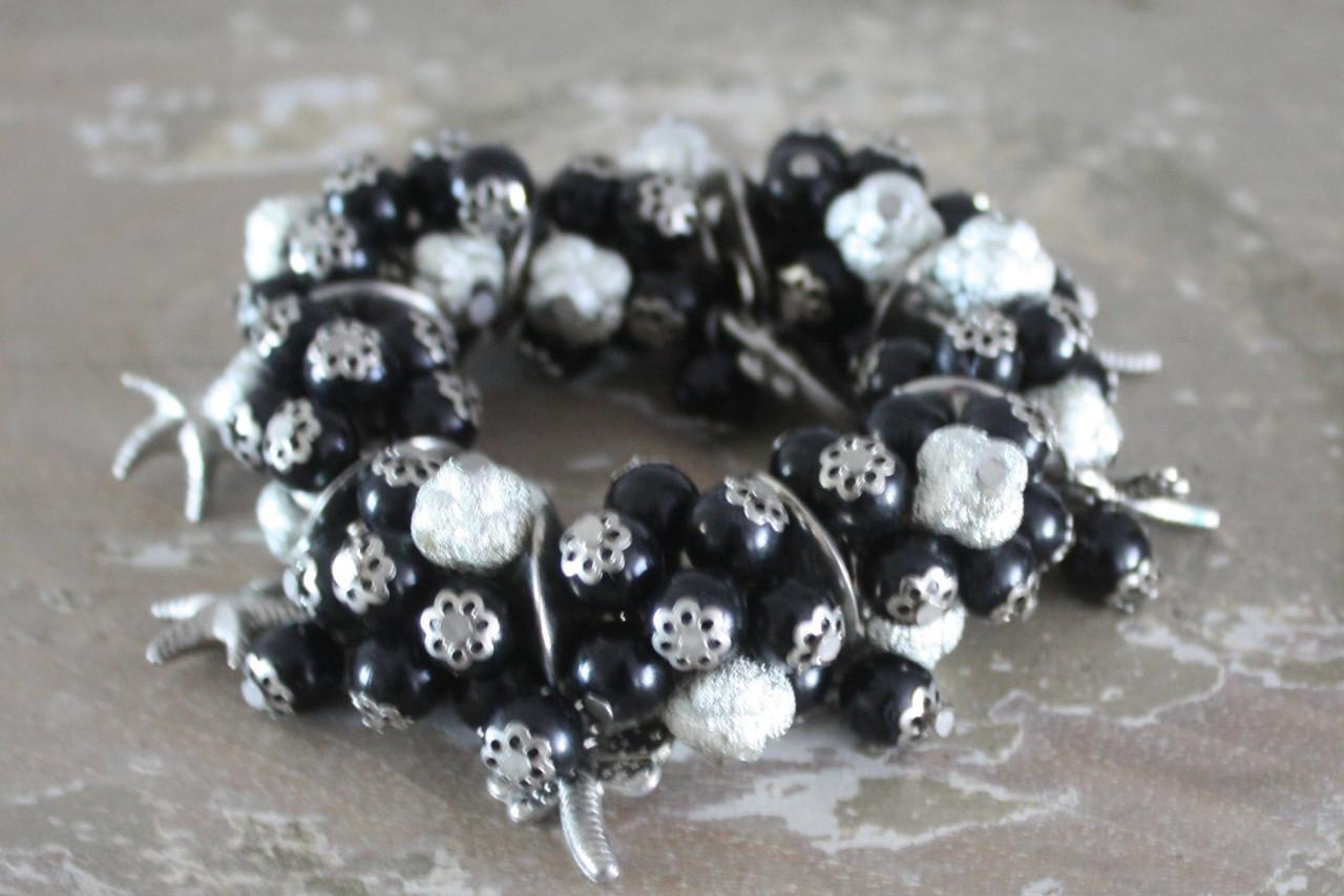 Rekbaren armband zwart zilveren kralen