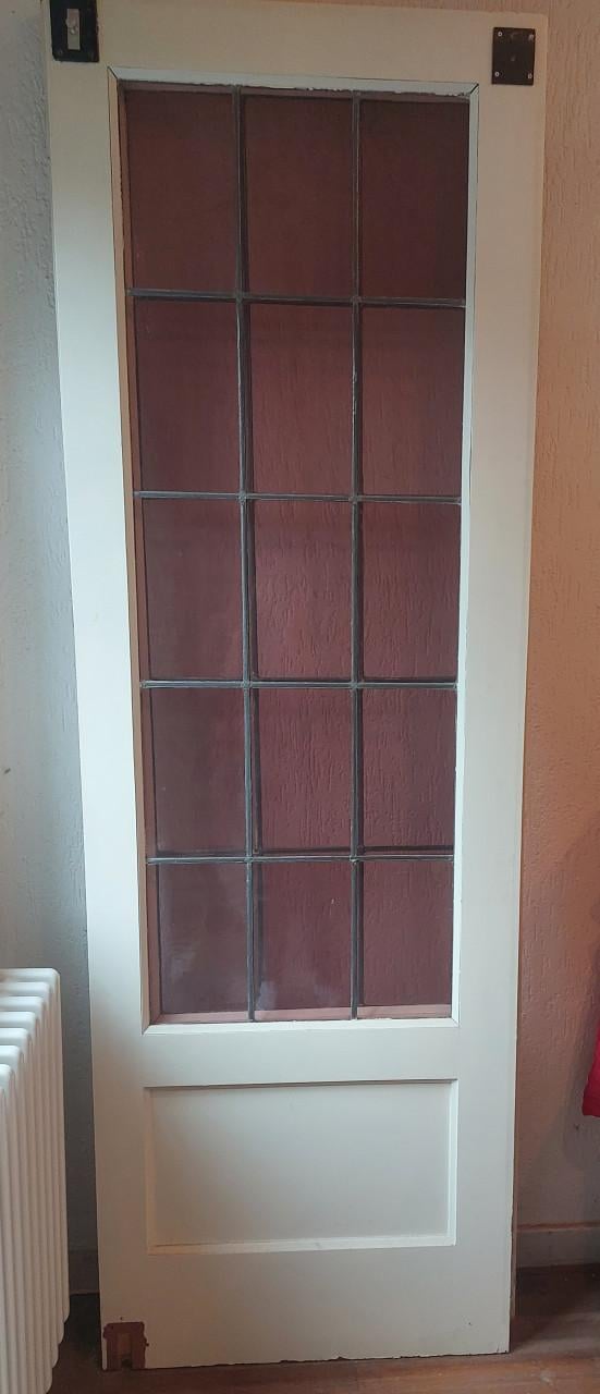 Twee draaideuren met glas en lood