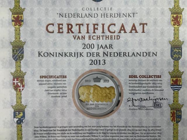 7 penningen uit de collectie “Nederland Herdenkt”.