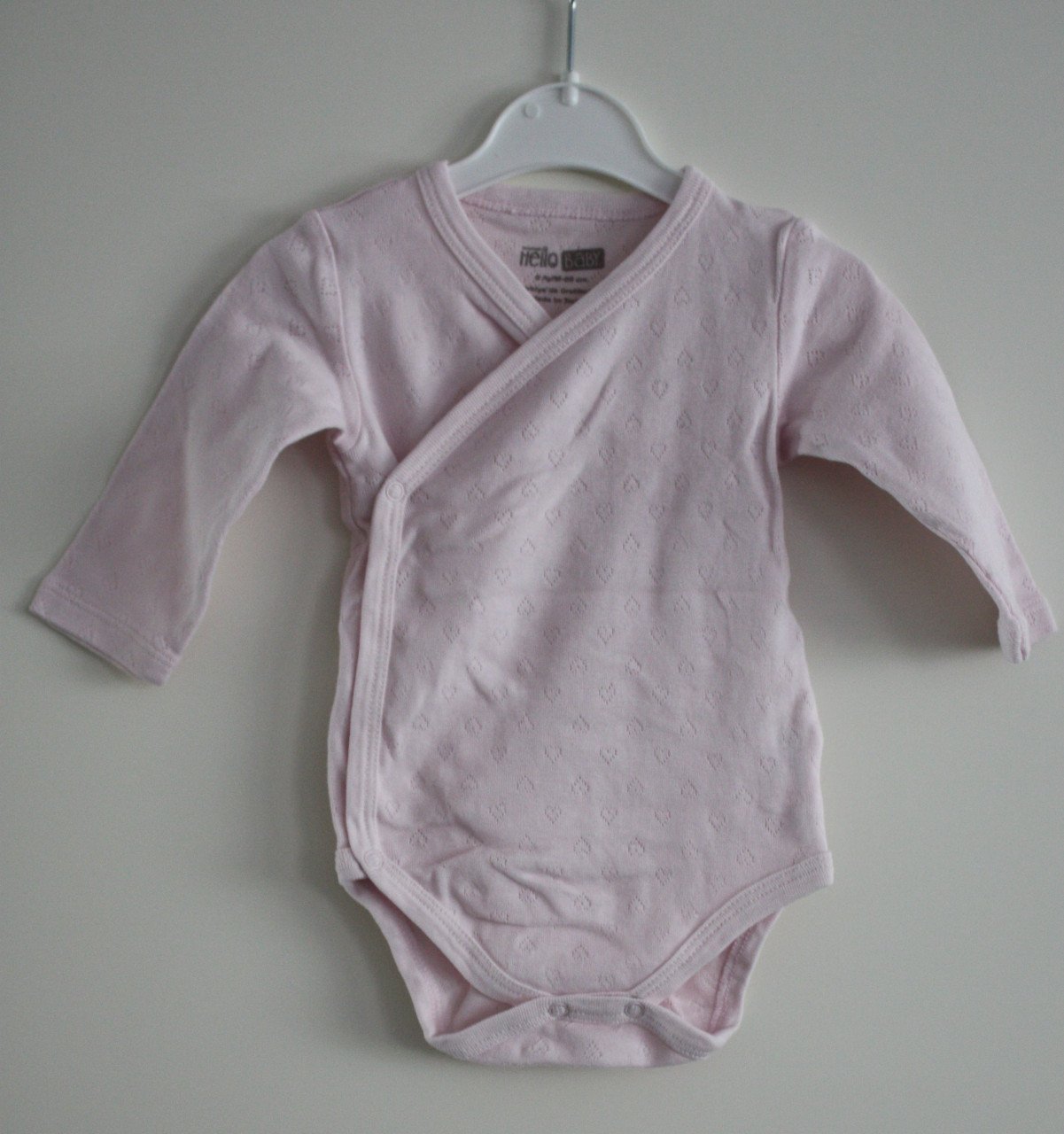 Roze romper maat 68