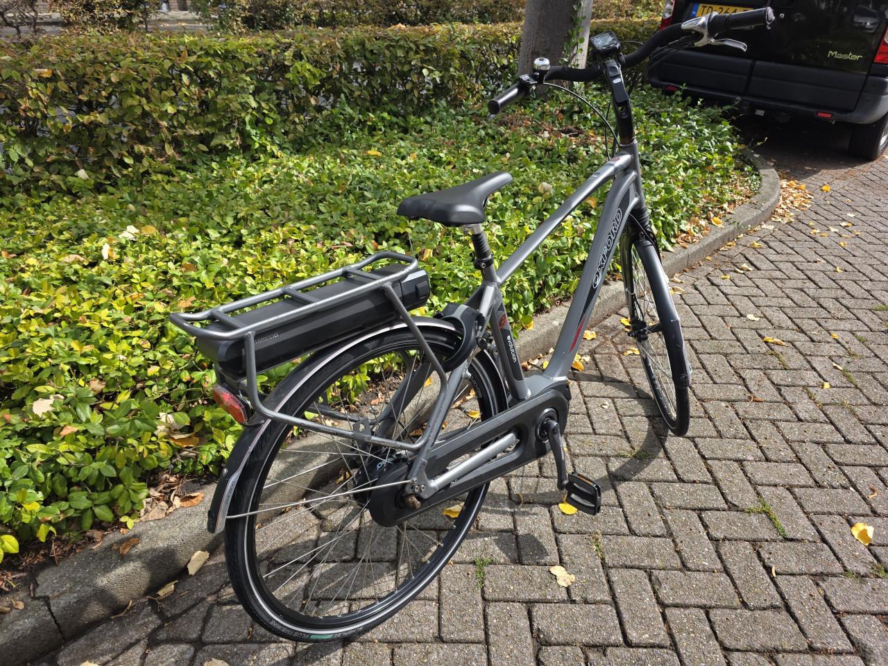 Keurig nette Oxford elektrische heren fiets met Shimano middenmotor