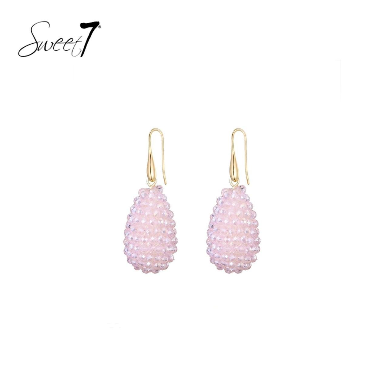 Oorbellen met roze kralen met een ovale hanger