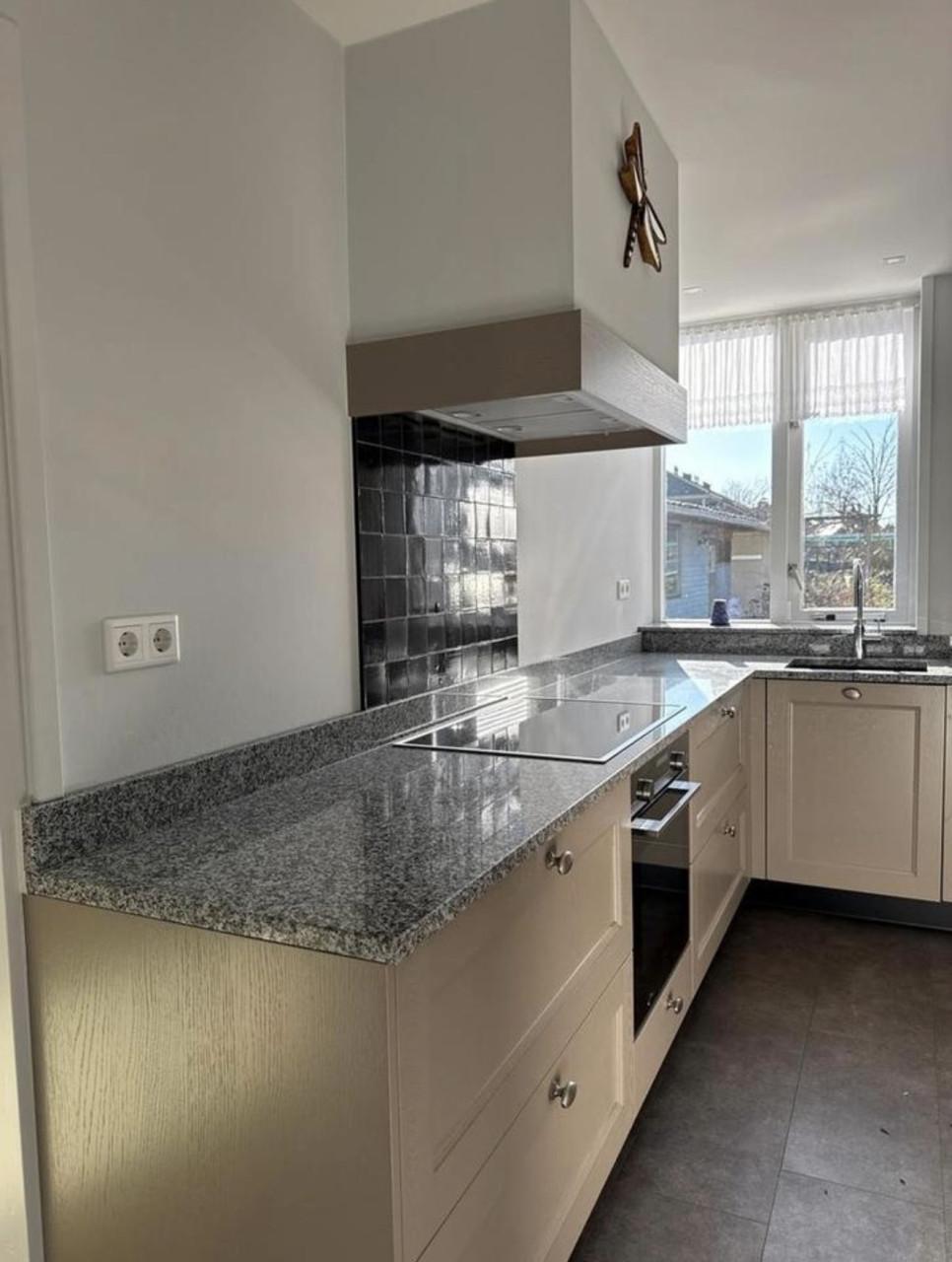 Complete hoekkeuken met Quooker, Siemens en Atag apparatuur