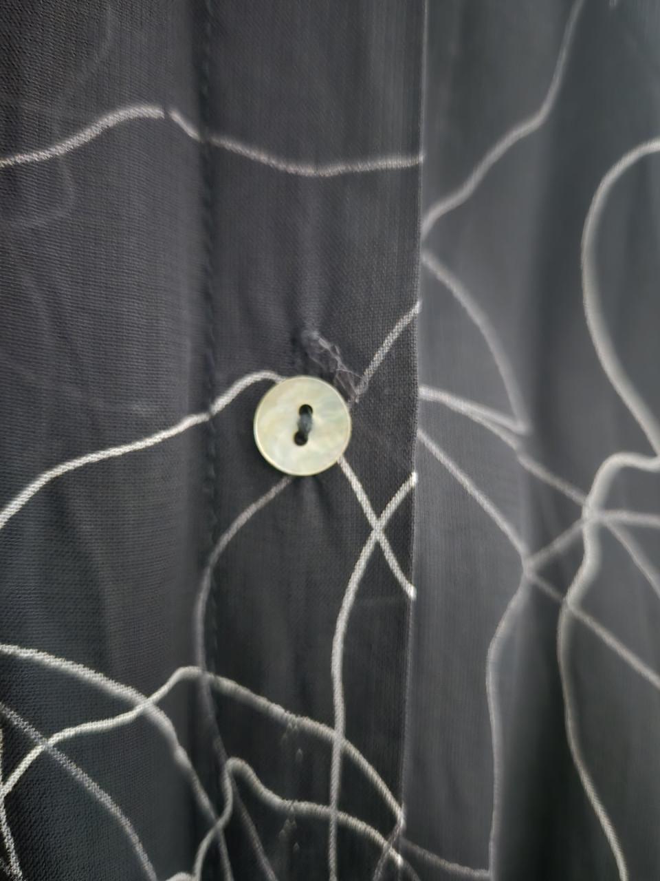 Zwarte, doorschijnende blouse van M&S . Maat 42