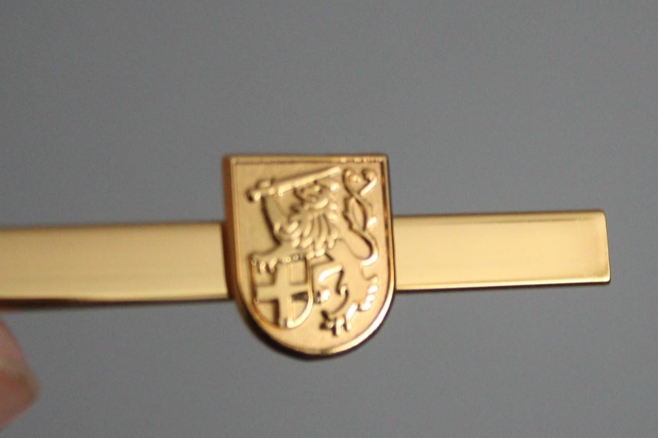 Goudkleurige dasspeld met leeuw