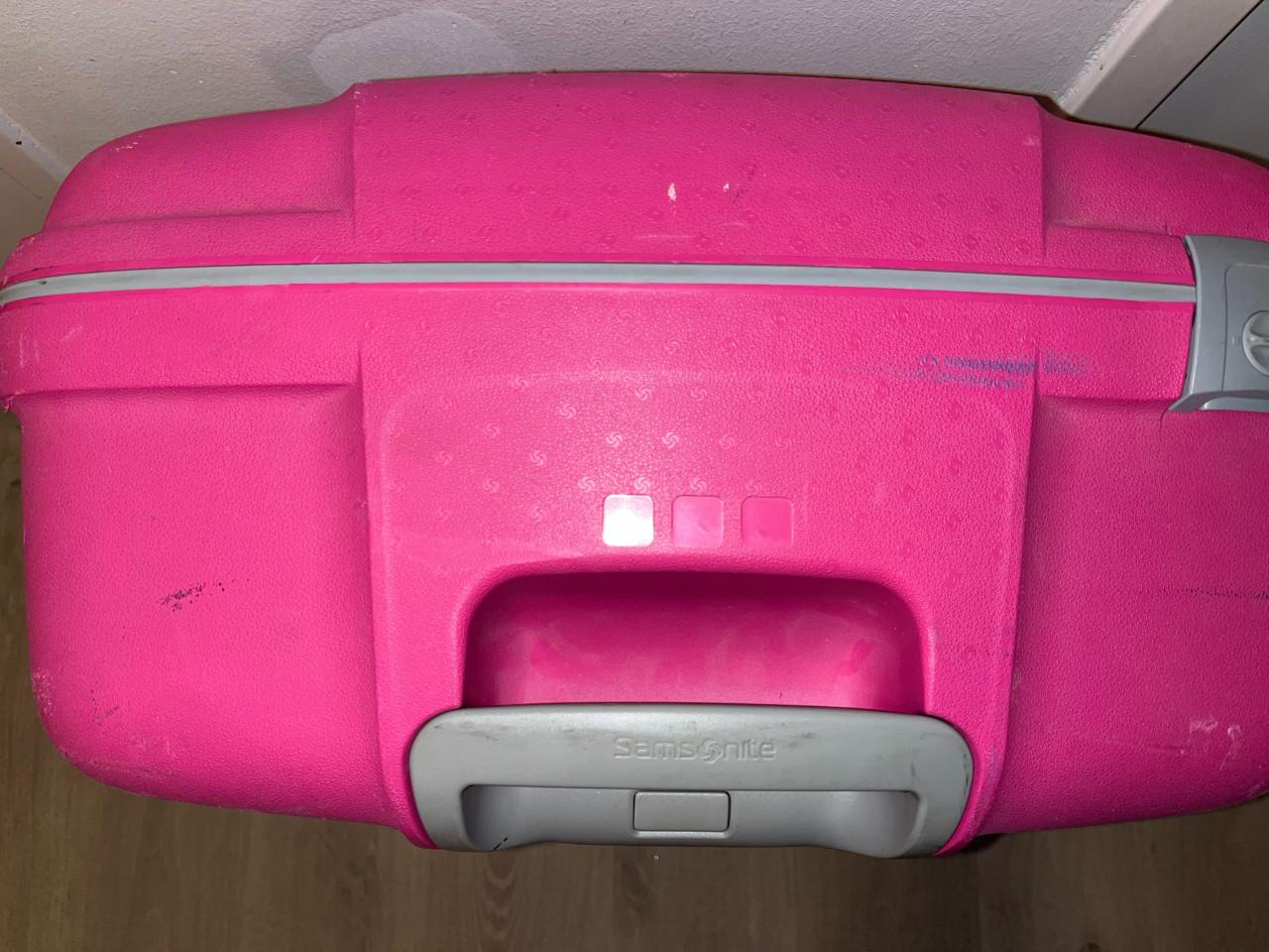 Grote roze Samsonite koffer