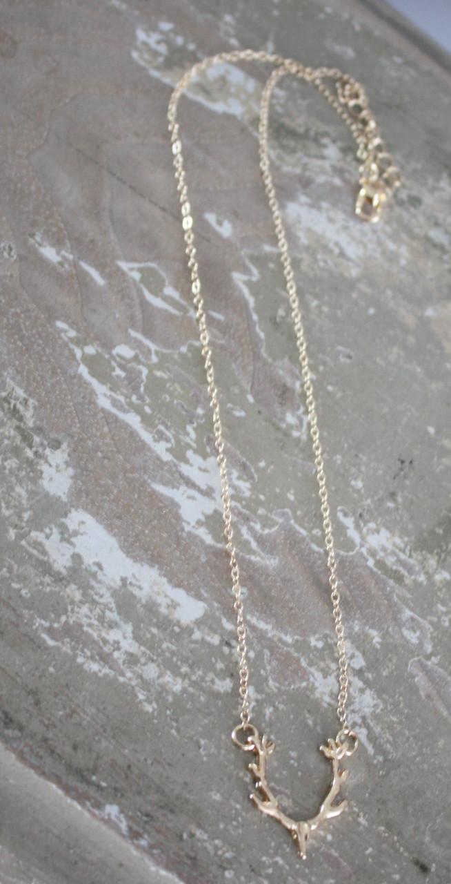 Goudkleurige ketting met herten kop