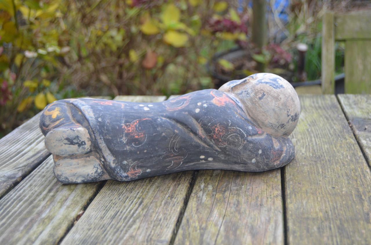 Chinees beeld van een slapend zotje ipst.