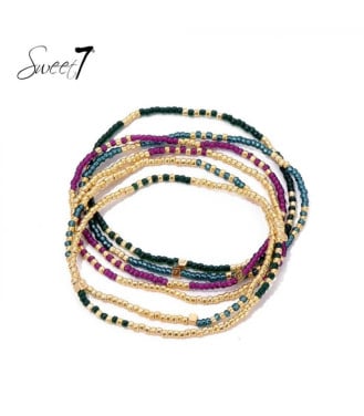 Armband met goud- en paarskleurige miyuki kralen