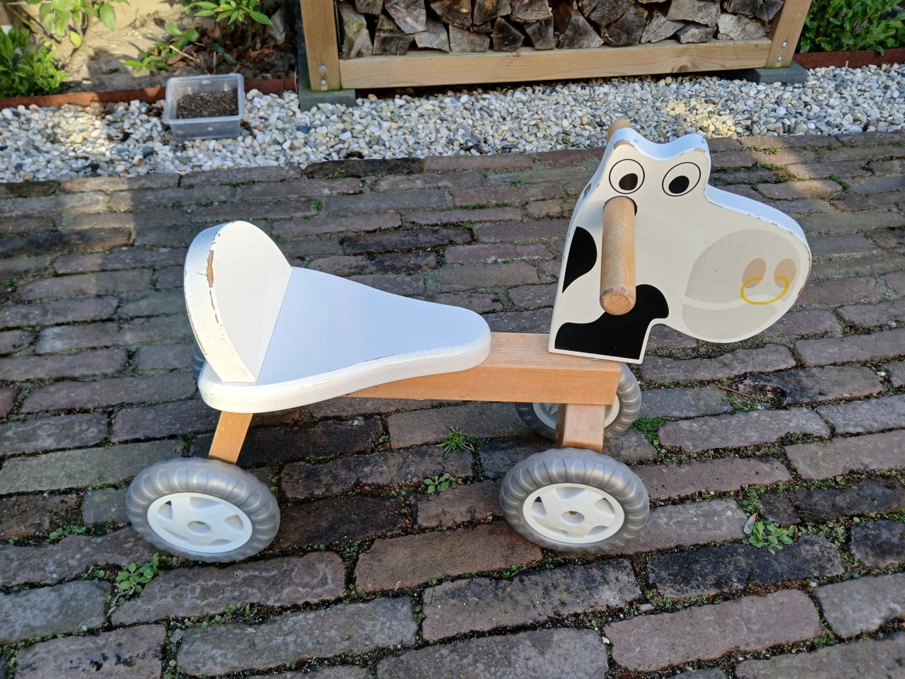 Houten loopfietsje koe