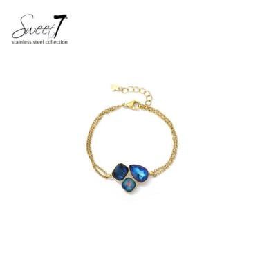 Armband met blauwe kristallen en goudkleurige schakel