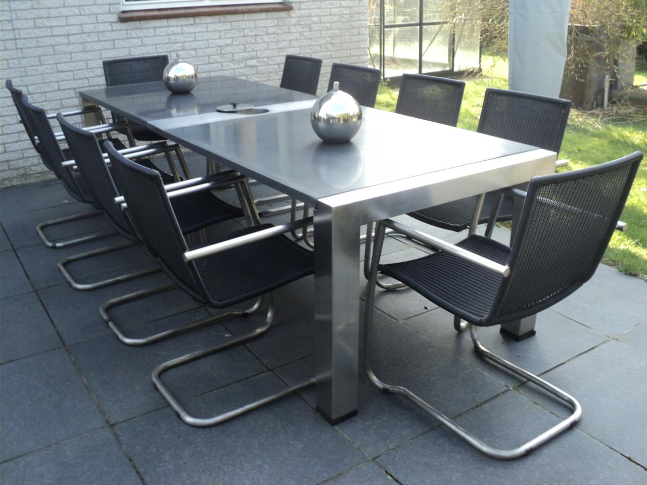 Prachtige RVS tafel met  graniet blad en 10 RVS stoelen