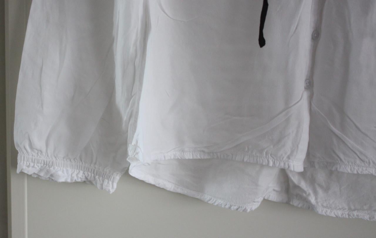 Witte blouse met zwarte toutjes  maat 34