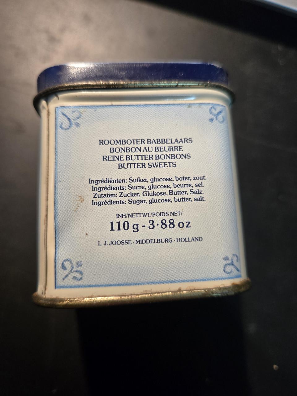 Delfst blauw blikje van roomboter babbelaars, leeg