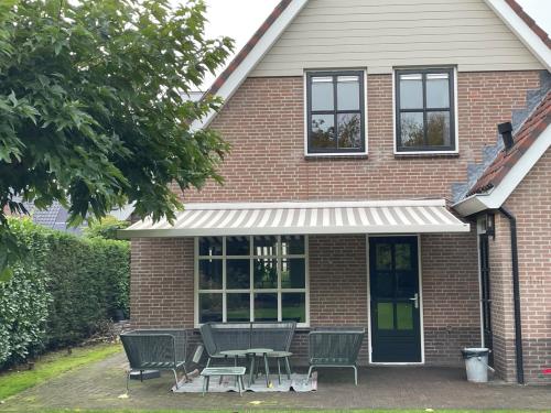 Zonnescherm knikarm elektrisch