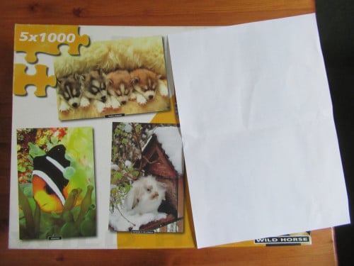 Doos met 3 leuke volledige puzzels van 1000 stukjes.