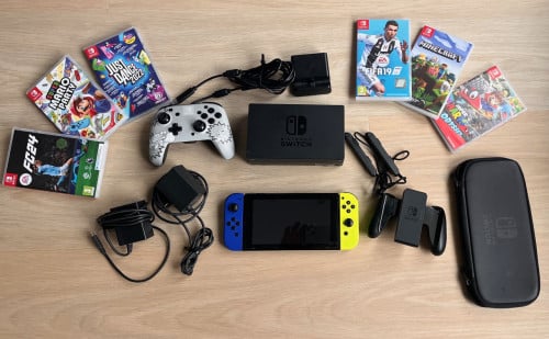 Nintendo Switch + extra controller + 6 games