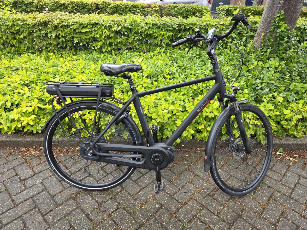 Keurig nette Stella elektrische heren fiets met Shimano middenmotor