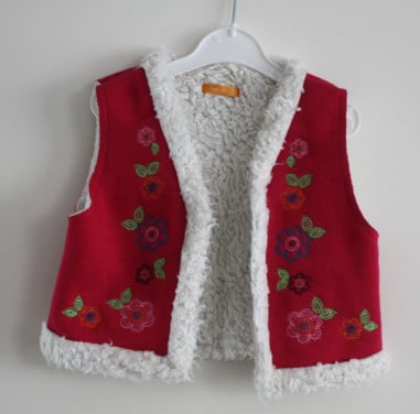 Roze bodywarmer met borduursel maat 86-92