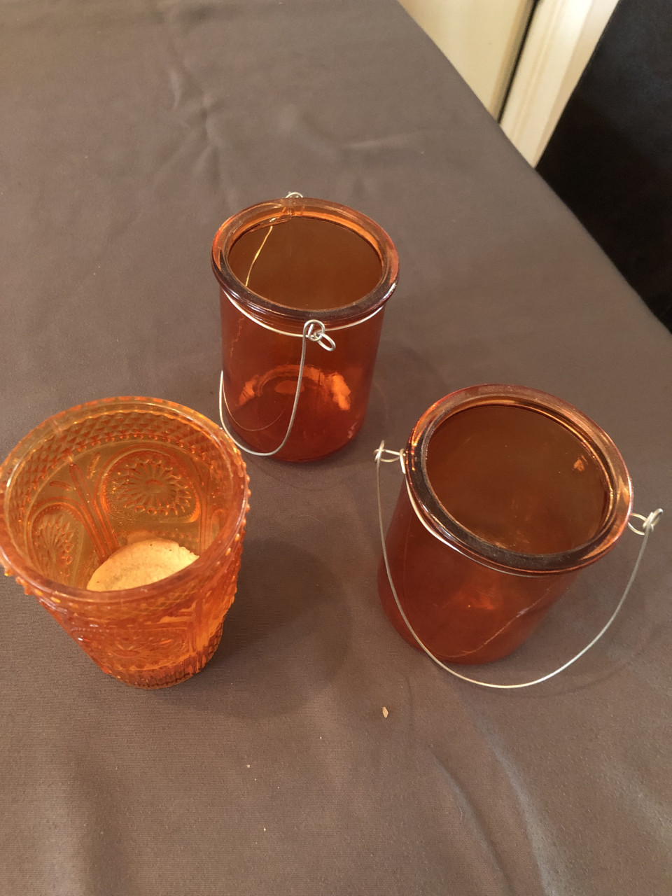 3 oranje waxinelichtjes