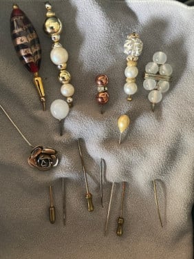 Broche en Hoedenspelden
