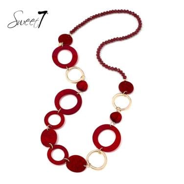 Halsketting met rode cirkels en goudkleurige ringen