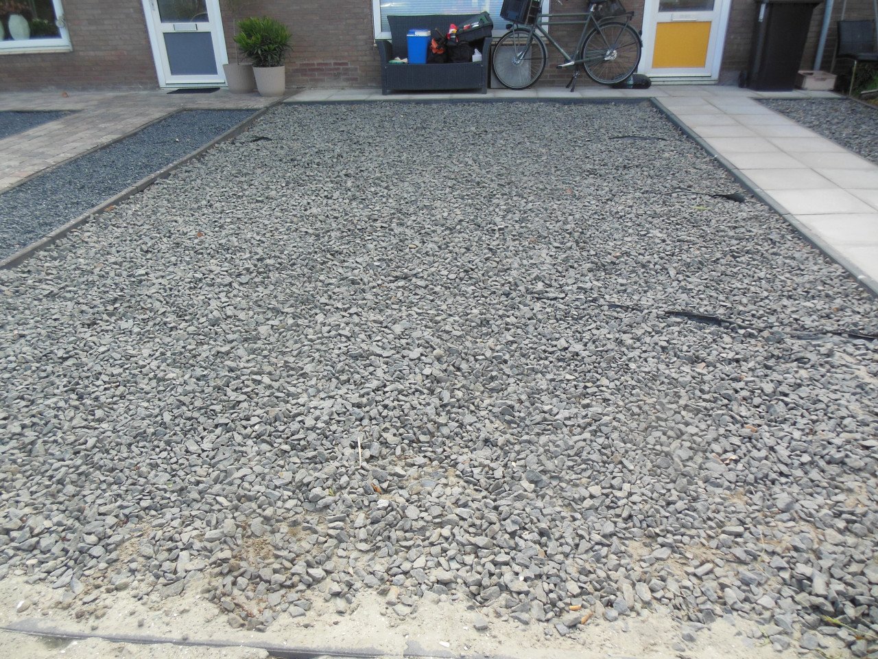 Onkruid verwijderen uit uw tuin.